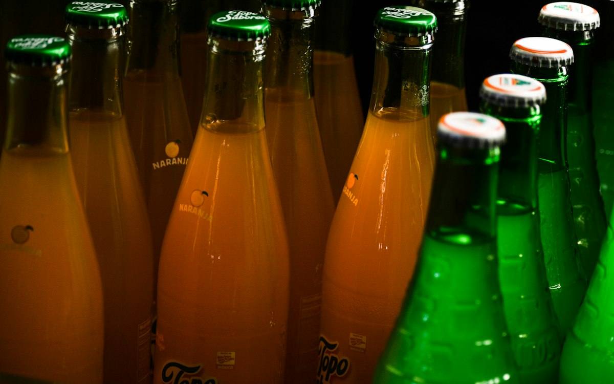 Bottled carbonated soft drinks preserved with sodium benzoate