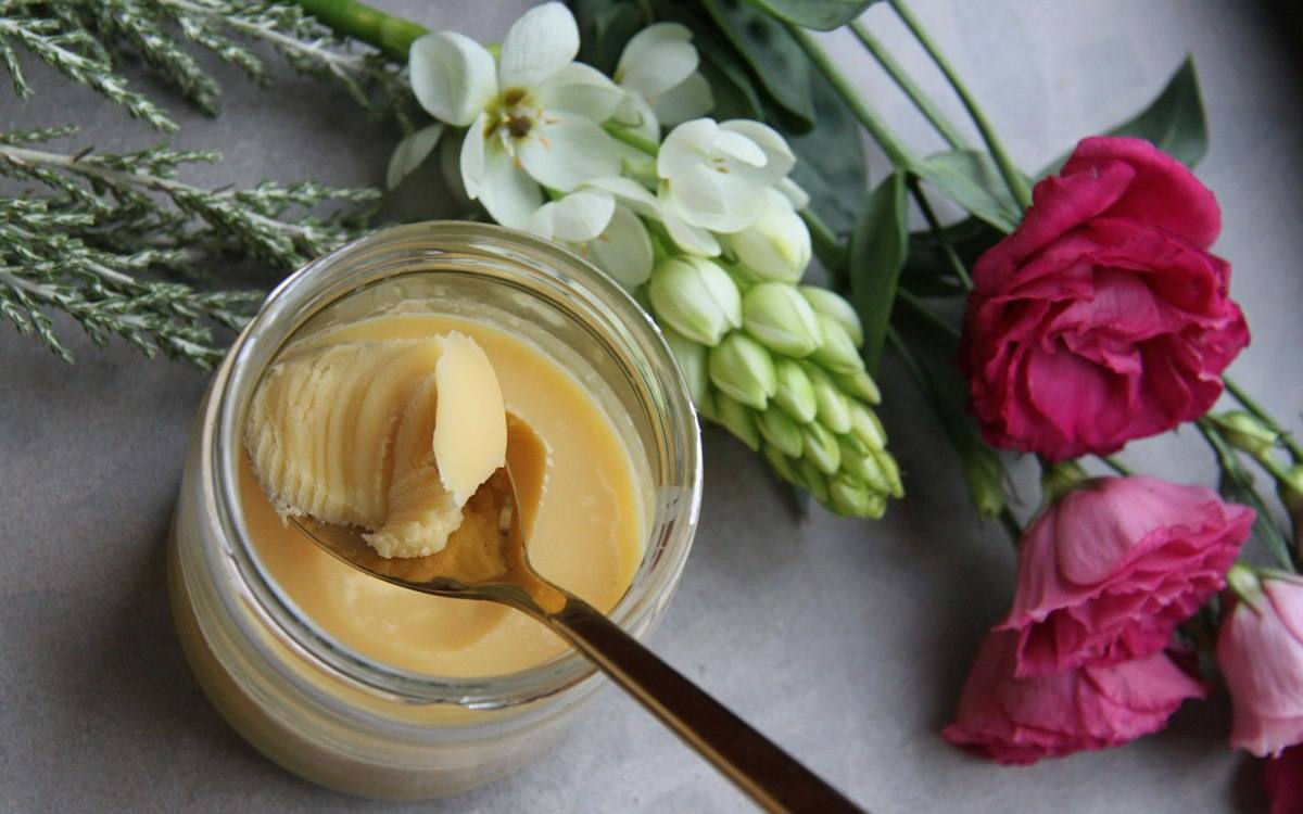 Jar of golden ghee coloured with beta carotene