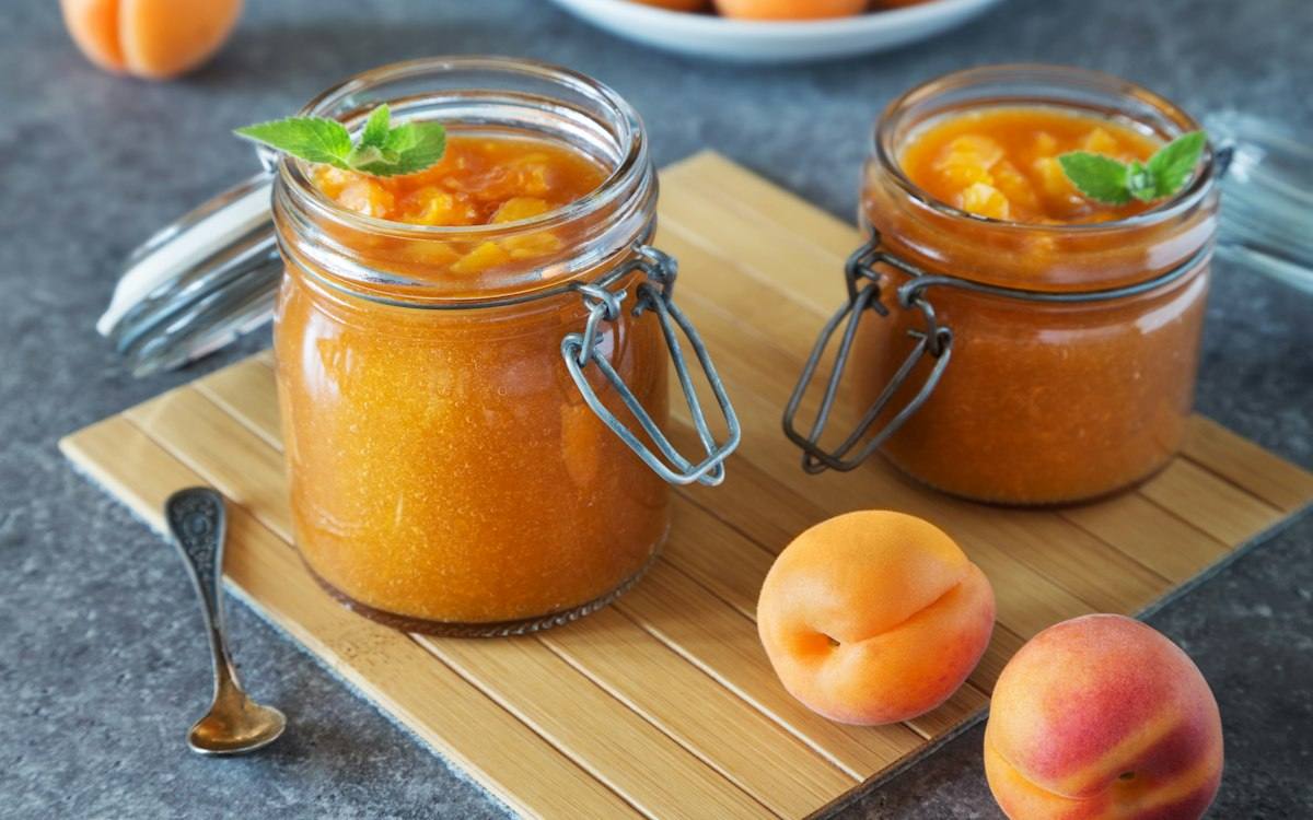 Jars of apricot jam set with pectin and preserved with food-grade acidulants